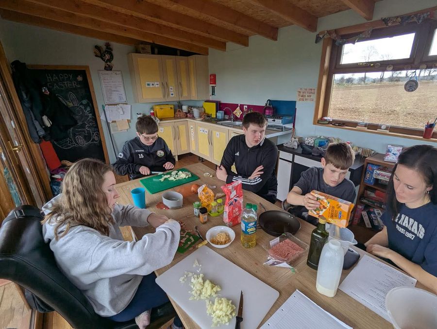 Helping prepare ingredients together in the kitchen